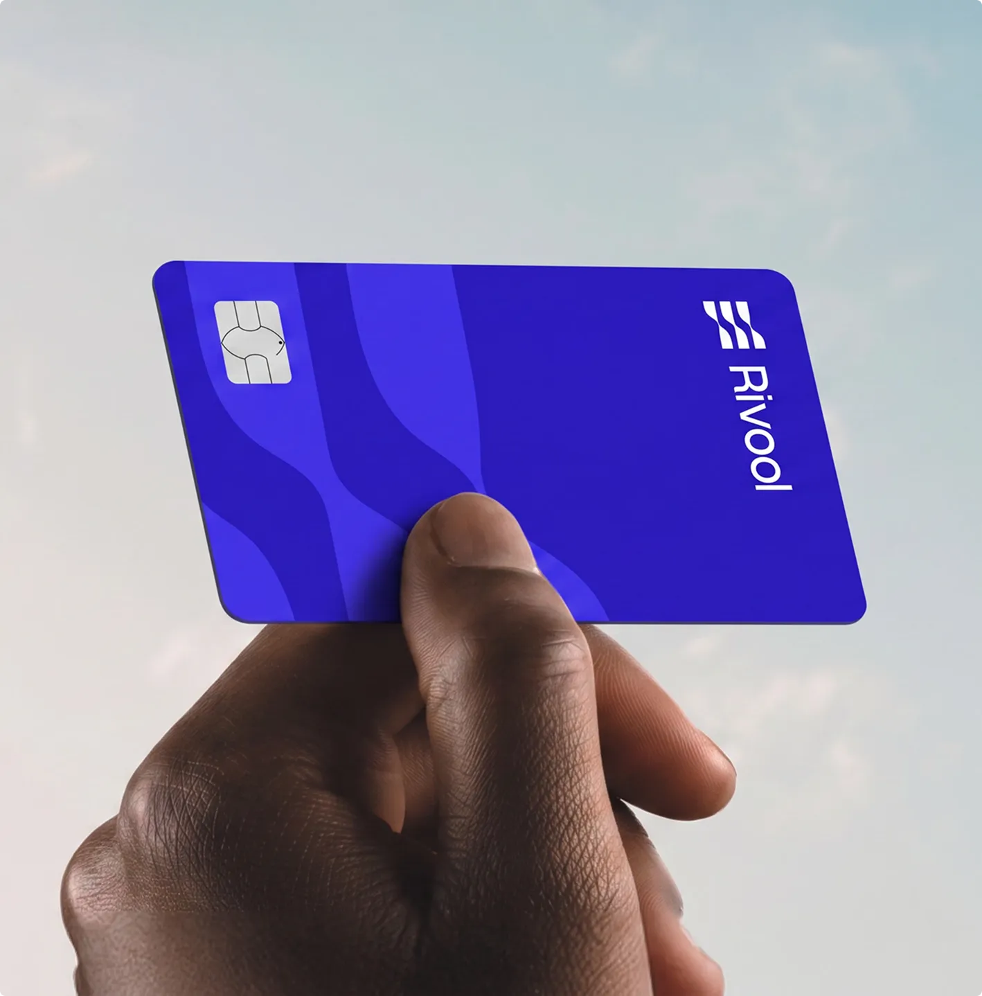 Hand holding the Rivool card