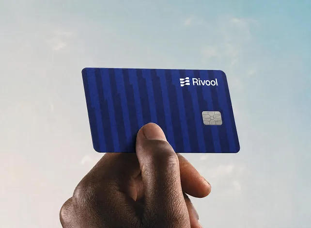 Hand holding the Rivool card